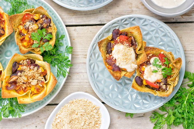 Top view on two plates wth Easy Vegan Taco Cups.