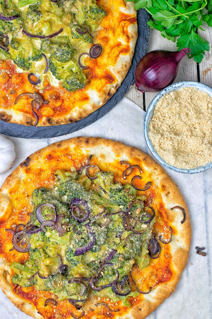 Two portions of Broccoli Cheese Vegan Pizza.