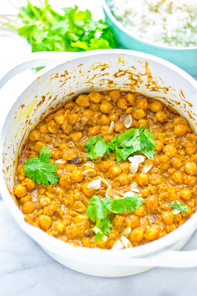 Insanely delicious One Pot Chickpea Biryani full of amazing flavors and naturally vegan, gluten free. An easy dish which is perfect for lunch, dinner, meal prep and work lunch. If you're looking for a super easy biryani try it now. #vegan #glutenfree #dairyfree #vegetarian #chickpeas #chickpeabiryani #biryani #onepotmeals #mealprep #worklunchideas #dinner #lunch #contentednesscooking