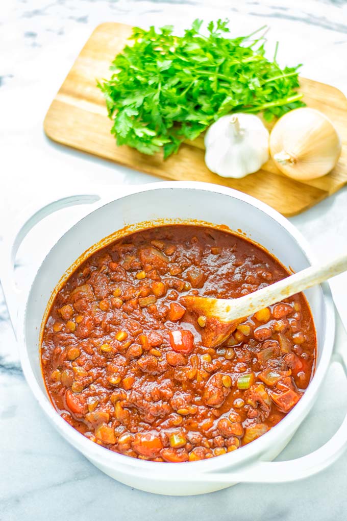 This Chickpea Lentil Bolognese is naturally vegan, gluten free and so super easy to make in one pot. It's amazing over your favorite pasta for dinner, lunch, meal preparation or a great dairy free alternative for work lunch. #vegan #glutenfree #dairyfree #vegetarian #onepotmeals #dinner #lunch #mealprep #worklunchideas #chickpeas #lentils #chickpeabolognese #lentilbolognese #contentednesscooking