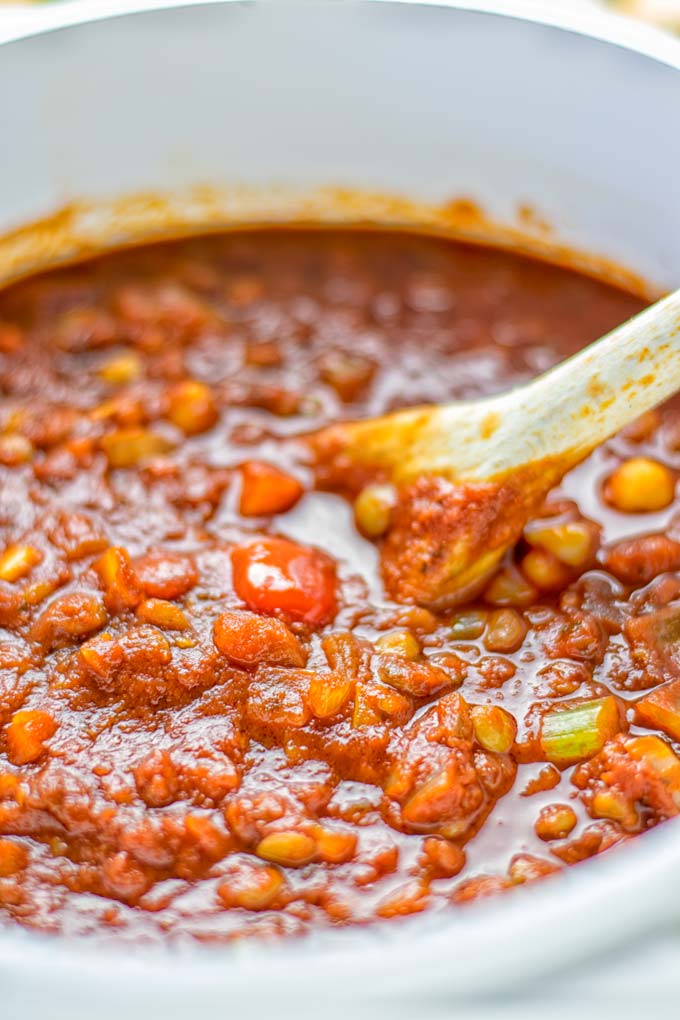 This Chickpea Lentil Bolognese is naturally vegan, gluten free and so super easy to make in one pot. It's amazing over your favorite pasta for dinner, lunch, meal preparation or a great dairy free alternative for work lunch. #vegan #glutenfree #dairyfree #vegetarian #onepotmeals #dinner #lunch #mealprep #worklunchideas #chickpeas #lentils #chickpeabolognese #lentilbolognese #contentednesscooking
