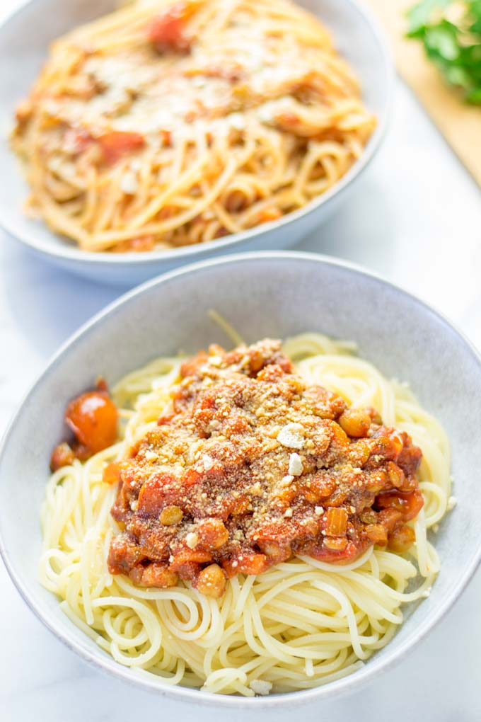This Chickpea Lentil Bolognese is naturally vegan, gluten free and so super easy to make in one pot. It's amazing over your favorite pasta for dinner, lunch, meal preparation or a great dairy free alternative for work lunch. #vegan #glutenfree #dairyfree #vegetarian #onepotmeals #dinner #lunch #mealprep #worklunchideas #chickpeas #lentils #chickpeabolognese #lentilbolognese #contentednesscooking