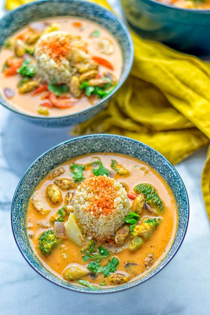 This Red Curry Coconut Soup is a super easy one pot meal and packed with such amazing flavors. It's creamy and naturally vegan, gluten free. It's an amazing dairy free alternative for lunch, dinner, meal preparation, that the whole family will love, or work lunches. Try it now and know how ridiculously easy delicious food can be. #vegan #glutenfree #dairyfree #contentednesscooking #dinner #lunch #onepotmeals #dairyfree #worklunchideas #curry #easyfood #vegetarian #soup #mealprep