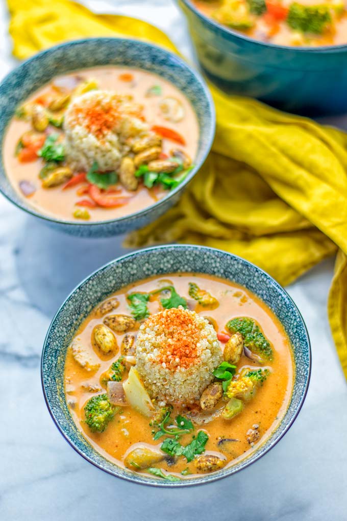 This Red Curry Coconut Soup is a super easy one pot meal and packed with such amazing flavors. It's creamy and naturally vegan, gluten free. It's an amazing dairy free alternative for lunch, dinner, meal preparation, that the whole family will love, or work lunches. Try it now and know how ridiculously easy delicious food can be. #vegan #glutenfree #dairyfree #contentednesscooking #dinner #lunch #onepotmeals #dairyfree #worklunchideas #curry #easyfood #vegetarian #soup #mealprep