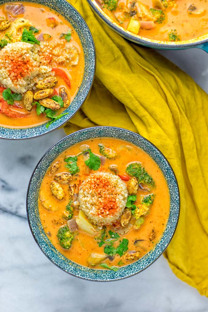 This Red Curry Coconut Soup is a super easy one pot meal and packed with such amazing flavors. It's creamy and naturally vegan, gluten free. It's an amazing dairy free alternative for lunch, dinner, meal preparation, that the whole family will love, or work lunches. Try it now and know how ridiculously easy delicious food can be. #vegan #glutenfree #dairyfree #contentednesscooking #dinner #lunch #onepotmeals #dairyfree #worklunchideas #curry #easyfood #vegetarian #soup #mealprep