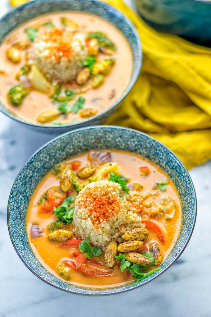 This Red Curry Coconut Soup is a super easy one pot meal and packed with such amazing flavors. It's creamy and naturally vegan, gluten free. It's an amazing dairy free alternative for lunch, dinner, meal preparation, that the whole family will love, or work lunches. Try it now and know how ridiculously easy delicious food can be. #vegan #glutenfree #dairyfree #contentednesscooking #dinner #lunch #onepotmeals #dairyfree #worklunchideas #curry #easyfood #vegetarian #soup #mealprep