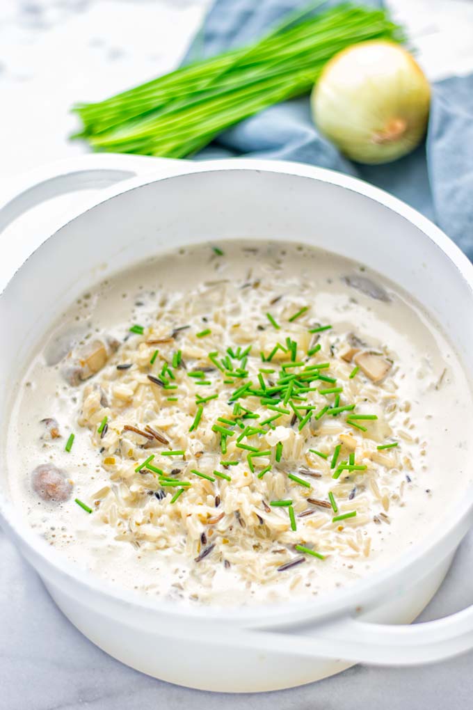 This Wild Rice and Mushroom Soup is entirely vegan, gluten free, and super easy to make in one pot. So amazing for the holidays, Christmas, dinner, lunch, meal preparation and work lunches. If you're looking for a super easy and delicious one pot meal, you will make this over and over again. #vegan #glutenfree #dairyfree #vegetarian #onepotmeals #holidays #christmas #contentednesscooking #mushrooms #soup #wildricesoup #mushroomsoup #dinner #lunch #mealprep #worklunchideas