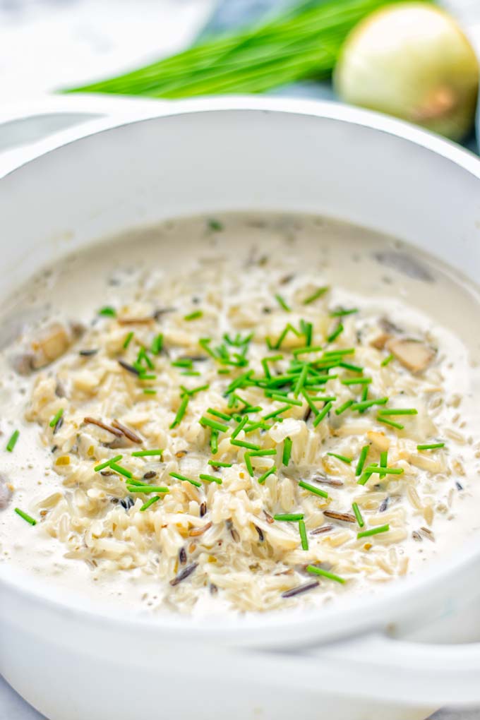 This Wild Rice and Mushroom Soup is entirely vegan, gluten free, and super easy to make in one pot. So amazing for the holidays, Christmas, dinner, lunch, meal preparation and work lunches. If you're looking for a super easy and delicious one pot meal, you will make this over and over again. #vegan #glutenfree #dairyfree #vegetarian #onepotmeals #holidays #christmas #contentednesscooking #mushrooms #soup #wildricesoup #mushroomsoup #dinner #lunch #mealprep #worklunchideas