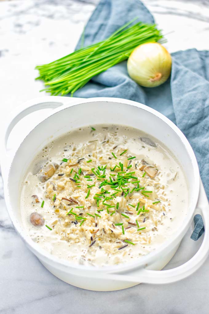 This Wild Rice and Mushroom Soup is entirely vegan, gluten free, and super easy to make in one pot. So amazing for the holidays, Christmas, dinner, lunch, meal preparation and work lunches. If you're looking for a super easy and delicious one pot meal, you will make this over and over again. #vegan #glutenfree #dairyfree #vegetarian #onepotmeals #holidays #christmas #contentednesscooking #mushrooms #soup #wildricesoup #mushroomsoup #dinner #lunch #mealprep #worklunchideas