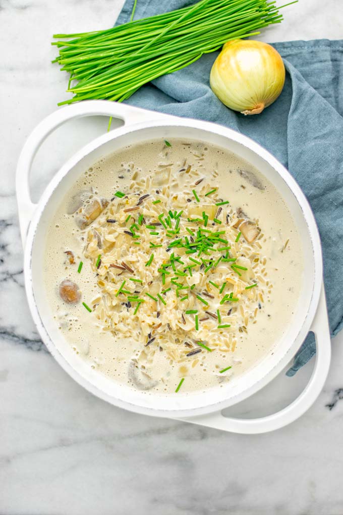 This Wild Rice and Mushroom Soup is entirely vegan, gluten free, and super easy to make in one pot. So amazing for the holidays, Christmas, dinner, lunch, meal preparation and work lunches. If you're looking for a super easy and delicious one pot meal, you will make this over and over again. #vegan #glutenfree #dairyfree #vegetarian #onepotmeals #holidays #christmas #contentednesscooking #mushrooms #soup #wildricesoup #mushroomsoup #dinner #lunch #mealprep #worklunchideas