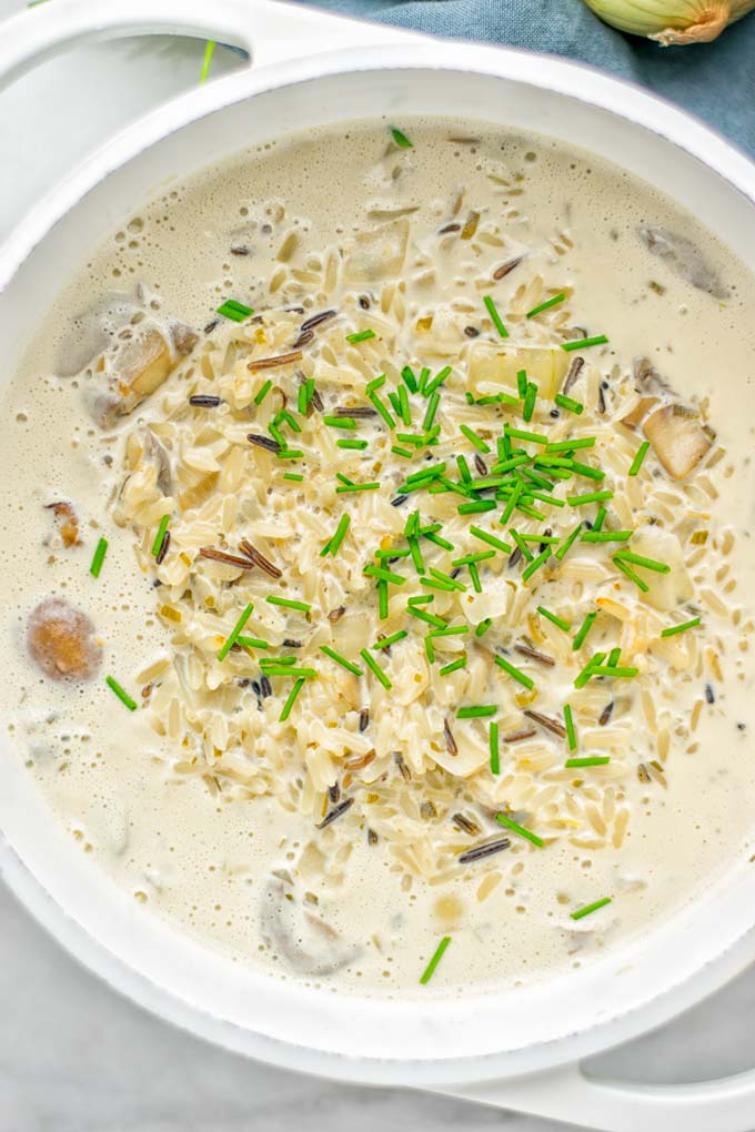 This Wild Rice and Mushroom Soup is entirely vegan, gluten free, and super easy to make in one pot. So amazing for the holidays, Christmas, dinner, lunch, meal preparation and work lunches. If you're looking for a super easy and delicious one pot meal, you will make this over and over again. #vegan #glutenfree #dairyfree #vegetarian #onepotmeals #holidays #christmas #contentednesscooking #mushrooms #soup #wildricesoup #mushroomsoup #dinner #lunch #mealprep #worklunchideas