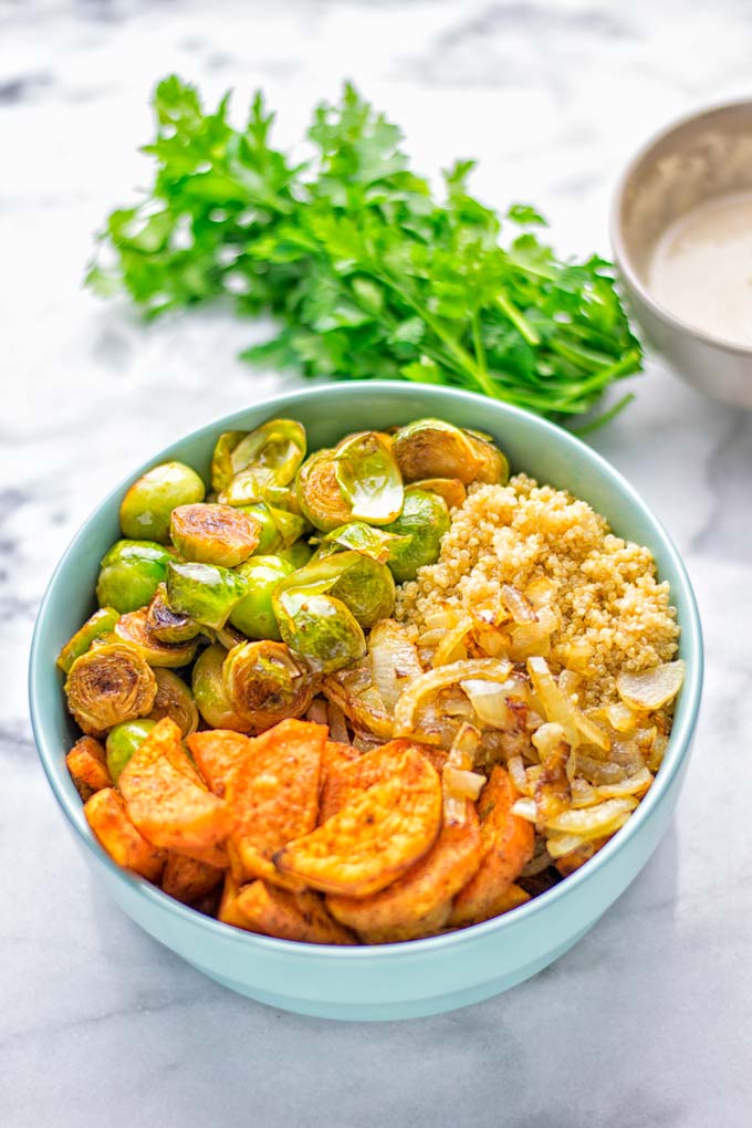 This Cajun Sweet Potato Brussels Sprout Salad is naturally vegan, gluten free and super easy to make. It's so delicious for lunch, dinner, meal prep, work lunch, holidays and Christmas. Try it now, make this keeper again and again. #vegan #glutenfree #dairyfree #vegetarian #contentednesscooking #mealprep #worklunchideas #dinner #lunch #brusselsproutsalad #cajunsweetpotatoes #holidayfood #christmasrecipes #roastedbrusselssprouts #christmasfood #holidayrecipes