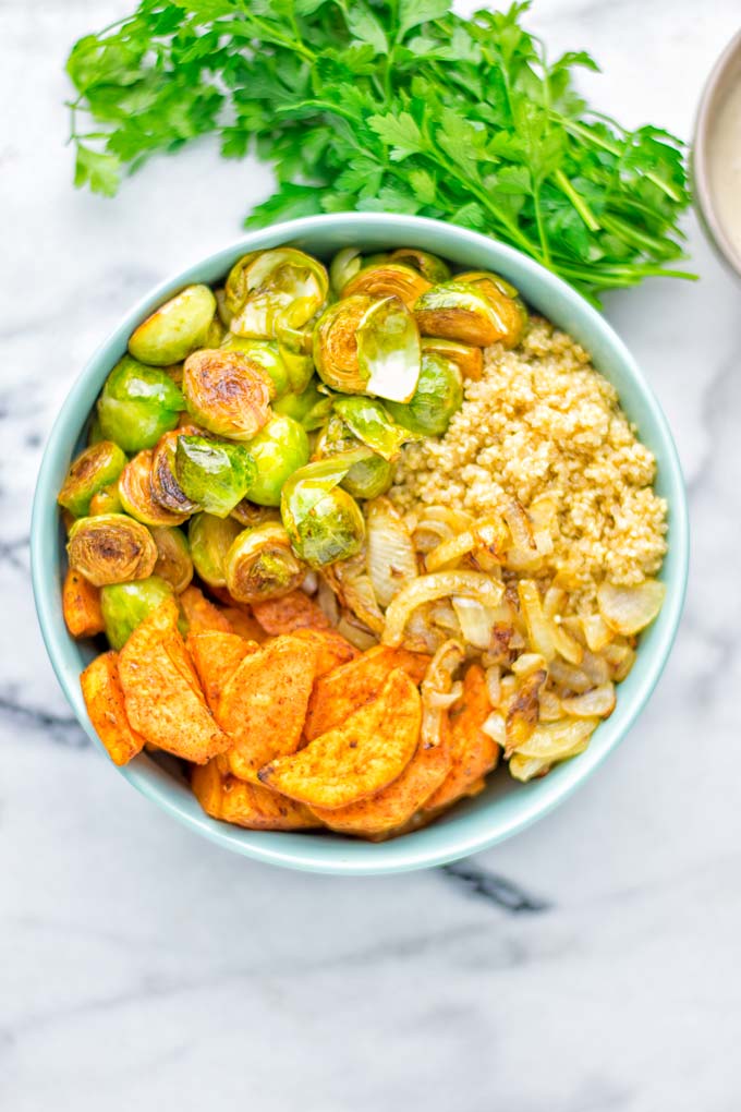 This Cajun Sweet Potato Brussels Sprout Salad is naturally vegan, gluten free and super easy to make. It's so delicious for lunch, dinner, meal prep, work lunch, holidays and Christmas. Try it now, make this keeper again and again. #vegan #glutenfree #dairyfree #vegetarian #contentednesscooking #mealprep #worklunchideas #dinner #lunch #brusselsproutsalad #cajunsweetpotatoes #holidayfood #christmasrecipes #roastedbrusselssprouts #christmasfood #holidayrecipes