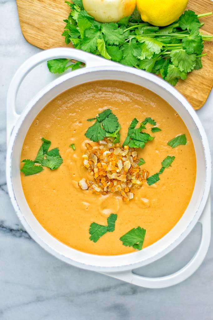 This Egyptian Red Lentil Soup is entirely vegan, gluten free, and so delicious. Packed with a delicious spice mix which take it to a whole new level. Try it now for dinner, lunch, meal preparation. You know what I'm talking about, yum! #vegan #glutenfree #dairyfree #vegetarian #lentils #dinner #lunch #mealprep #worklunchideas #redlentils #redlentilsoup #contentednesscooking #soup