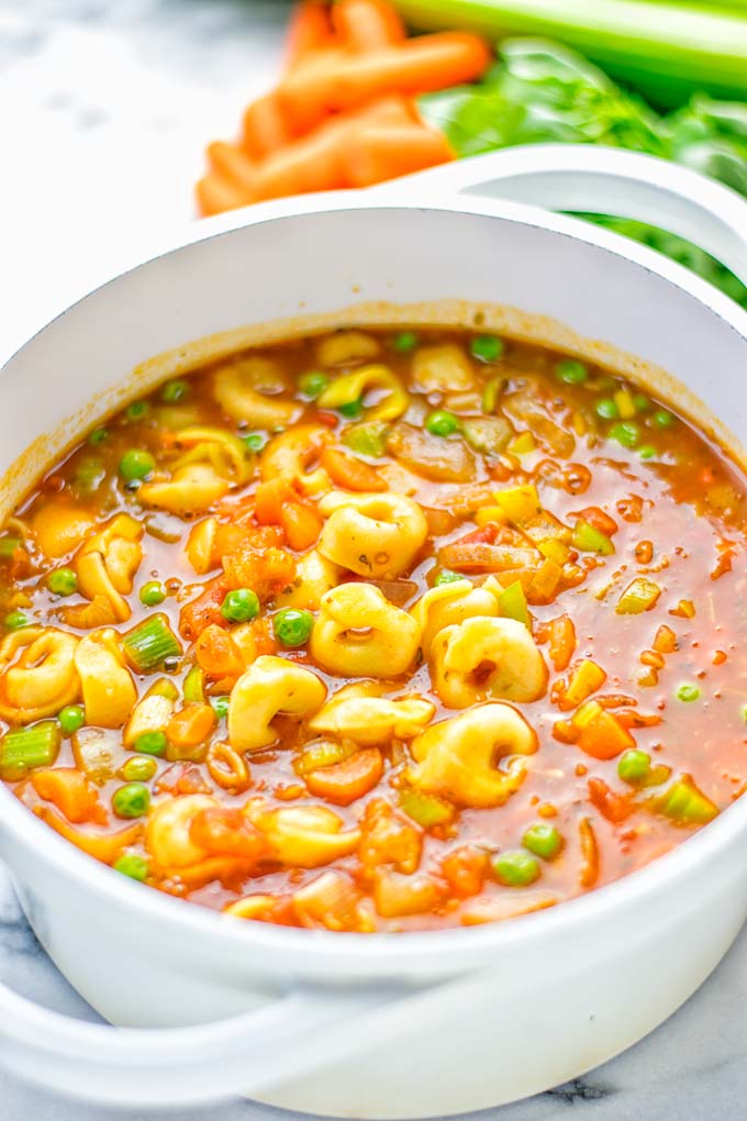 This Minestrone Tortellini Soup is entirely vegan, gluten free and super easy to make in one pot. If you're looking for a delicious minestrone recipe look no further and try it now for dinner, lunch, meal preparation or an amazing work lunch! #vegan #glutenfree #dairyfree #vegetarian #contentednesscooking #mealprep #onepotmeals #dinner #lunch #worklunchideas #minestrone #tortellinisoup #minestronesoup