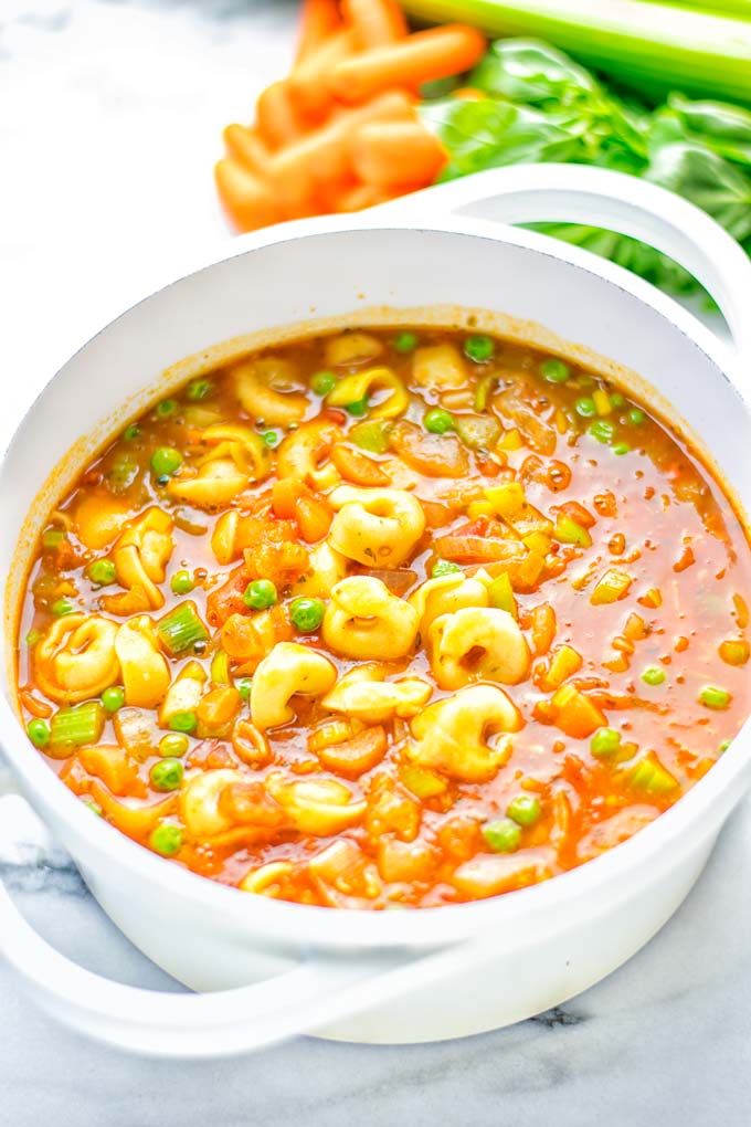 This Minestrone Tortellini Soup is entirely vegan, gluten free and super easy to make in one pot. If you're looking for a delicious minestrone recipe look no further and try it now for dinner, lunch, meal preparation or an amazing work lunch! #vegan #glutenfree #dairyfree #vegetarian #contentednesscooking #mealprep #onepotmeals #dinner #lunch #worklunchideas #minestrone #tortellinisoup #minestronesoup