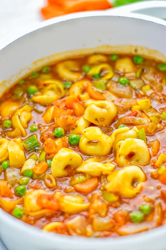 This Minestrone Tortellini Soup is entirely vegan, gluten free and super easy to make in one pot. If you're looking for a delicious minestrone recipe look no further and try it now for dinner, lunch, meal preparation or an amazing work lunch! #vegan #glutenfree #dairyfree #vegetarian #contentednesscooking #mealprep #onepotmeals #dinner #lunch #worklunchideas #minestrone #tortellinisoup #minestronesoup
