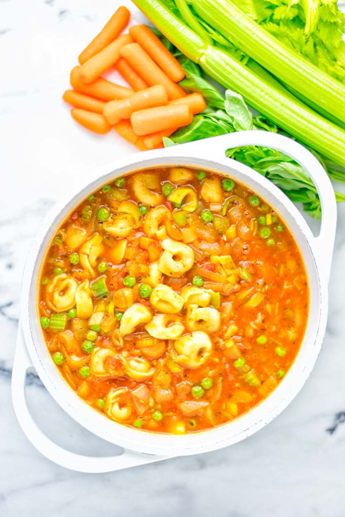 This Minestrone Tortellini Soup is entirely vegan, gluten free and super easy to make in one pot. If you're looking for a delicious minestrone recipe look no further and try it now for dinner, lunch, meal preparation or an amazing work lunch! #vegan #glutenfree #dairyfree #vegetarian #contentednesscooking #mealprep #onepotmeals #dinner #lunch #worklunchideas #minestrone #tortellinisoup #minestronesoup