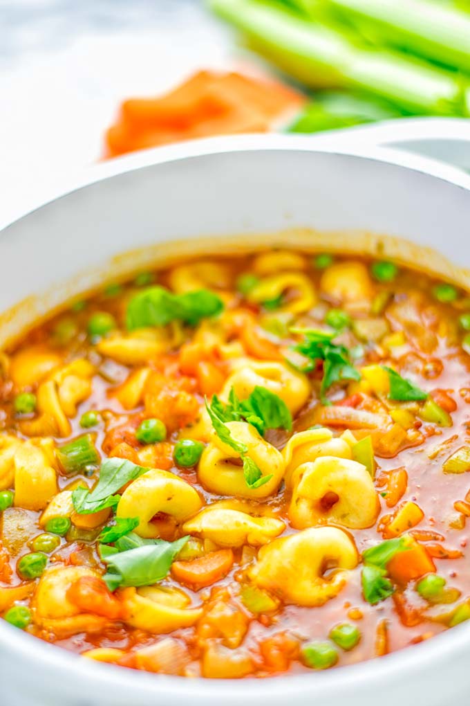This Minestrone Tortellini Soup is entirely vegan, gluten free and super easy to make in one pot. If you're looking for a delicious minestrone recipe look no further and try it now for dinner, lunch, meal preparation or an amazing work lunch! #vegan #glutenfree #dairyfree #vegetarian #contentednesscooking #mealprep #onepotmeals #dinner #lunch #worklunchideas #minestrone #tortellinisoup #minestronesoup
