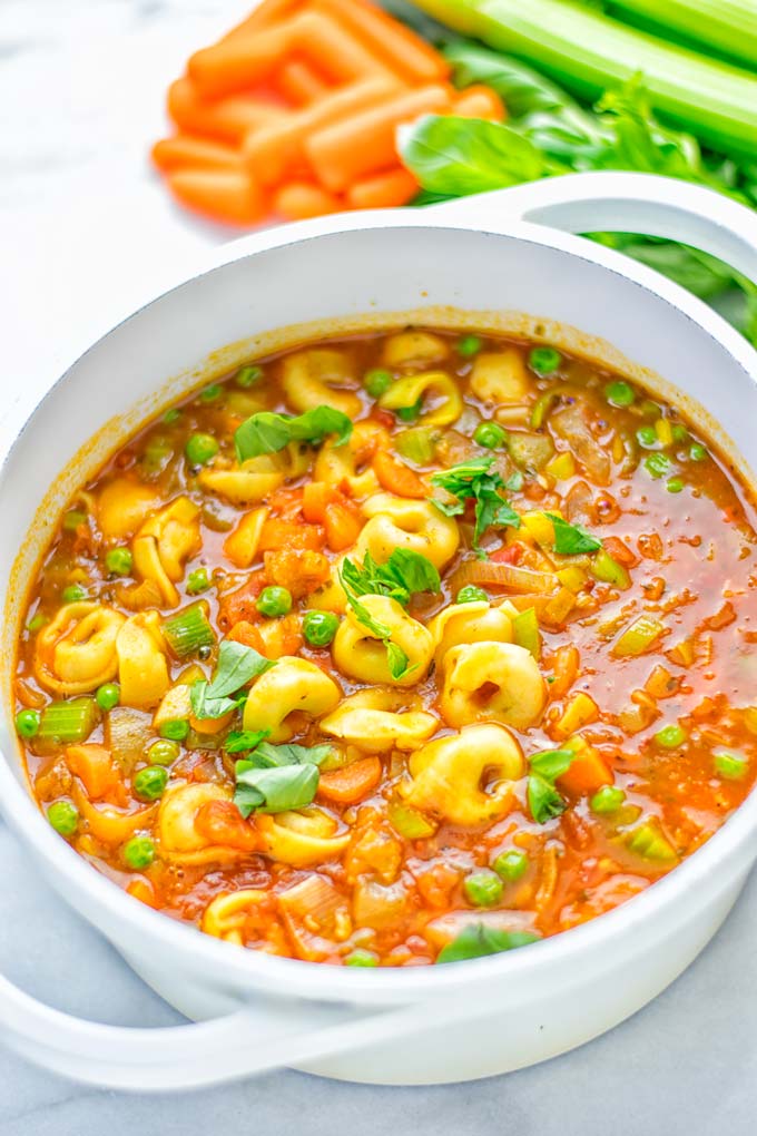 This Minestrone Tortellini Soup is entirely vegan, gluten free and super easy to make in one pot. If you're looking for a delicious minestrone recipe look no further and try it now for dinner, lunch, meal preparation or an amazing work lunch! #vegan #glutenfree #dairyfree #vegetarian #contentednesscooking #mealprep #onepotmeals #dinner #lunch #worklunchideas #minestrone #tortellinisoup #minestronesoup