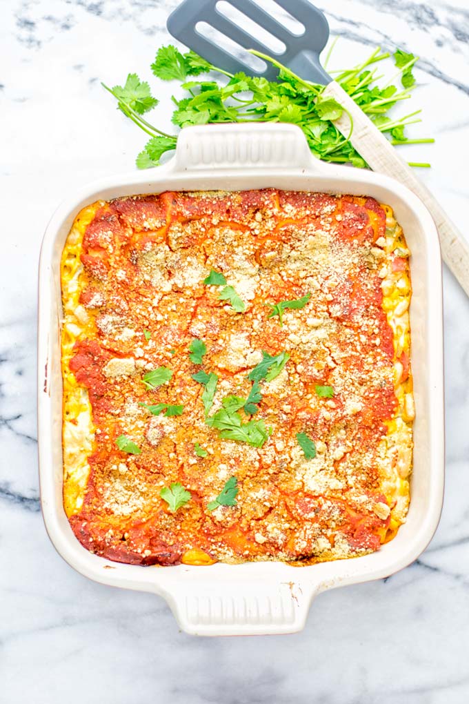 Super easy and insanely delicious White Chili Lasagna. Entirely vegan, gluten free and seriously so addictive. It's fantastic for dinner, lunch, meal preparation, work lunch that the whole family will love. Also a keeper for the holidays and date night. If you're looking for an easy lasagna recipe try this, now. #vegan #dairyfree #glutenfree #vegetarian #lasagna #mealprep #worklunchideas #whitechili #whitechilirecipes #holidays #dinner #lunch #datenightrecipesdinner #contentednesscooking