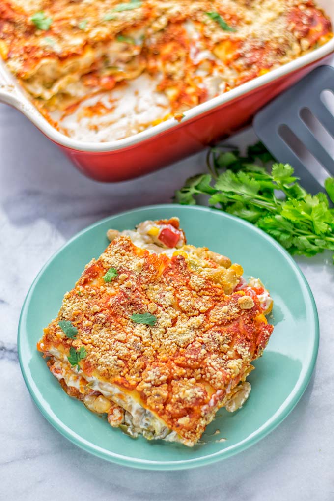 Super easy and insanely delicious White Chili Lasagna. Entirely vegan, gluten free and seriously so addictive. It's fantastic for dinner, lunch, meal preparation, work lunch that the whole family will love. Also a keeper for the holidays and date night. If you're looking for an easy lasagna recipe try this, now. #vegan #dairyfree #glutenfree #vegetarian #lasagna #mealprep #worklunchideas #whitechili #whitechilirecipes #holidays #dinner #lunch #datenightrecipesdinner #contentednesscooking