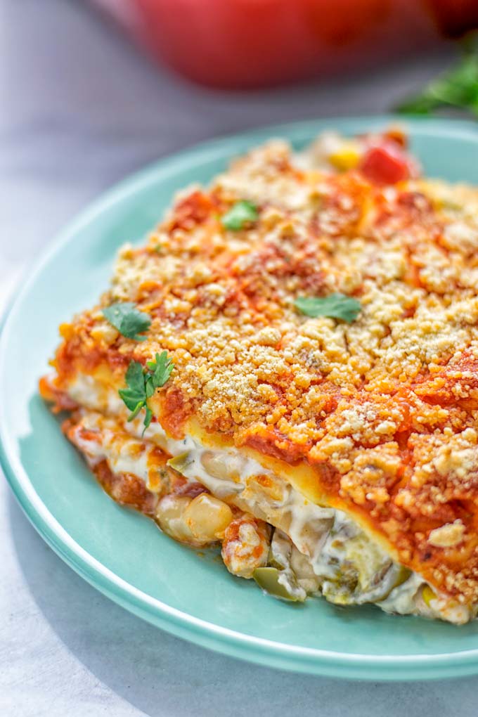 Super easy and insanely delicious White Chili Lasagna. Entirely vegan, gluten free and seriously so addictive. It's fantastic for dinner, lunch, meal preparation, work lunch that the whole family will love. Also a keeper for the holidays and date night. If you're looking for an easy lasagna recipe try this, now. #vegan #dairyfree #glutenfree #vegetarian #lasagna #mealprep #worklunchideas #whitechili #whitechilirecipes #holidays #dinner #lunch #datenightrecipesdinner #contentednesscooking