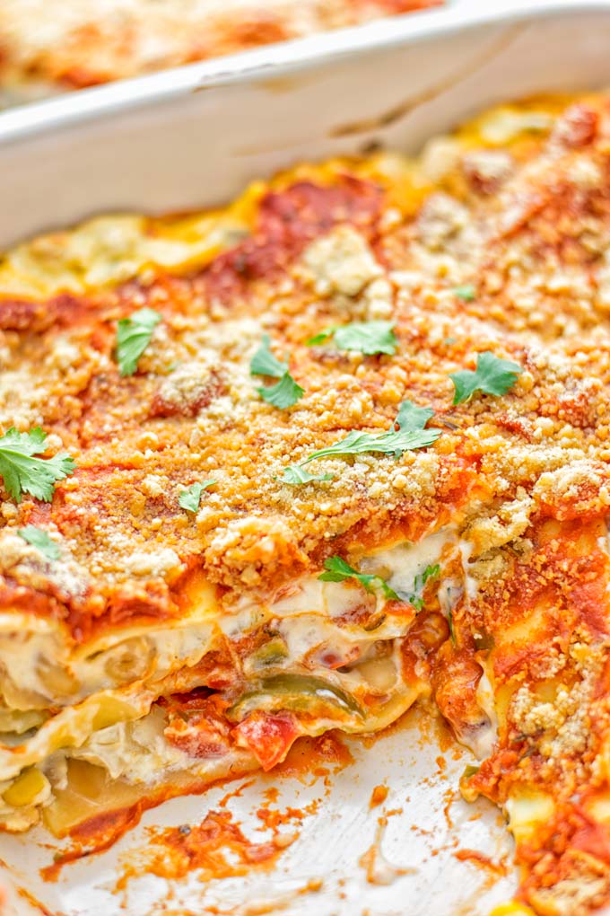 Super easy and insanely delicious White Chili Lasagna. Entirely vegan, gluten free and seriously so addictive. It's fantastic for dinner, lunch, meal preparation, work lunch that the whole family will love. Also a keeper for the holidays and date night. If you're looking for an easy lasagna recipe try this, now. #vegan #dairyfree #glutenfree #vegetarian #lasagna #mealprep #worklunchideas #whitechili #whitechilirecipes #holidays #dinner #lunch #datenightrecipesdinner #contentednesscooking