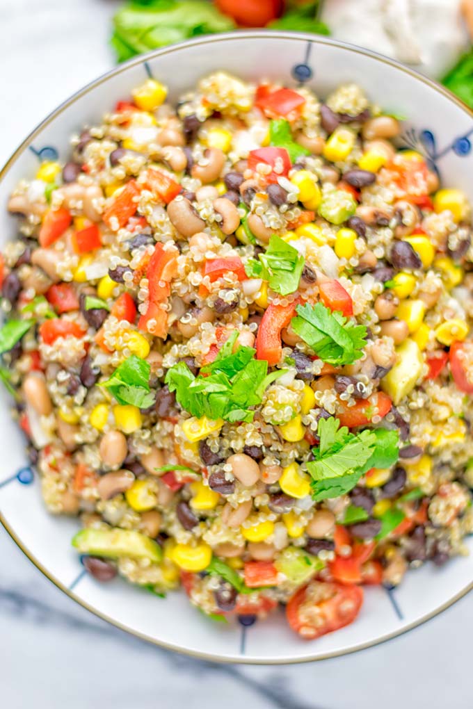 This Cowboy Caviar Quinoa Salad is naturally vegan, gluten free, and so satisfying. It has all the flavors you'll love and is super easy to make for dinner, lunch, meal prep and so much more. Enjoy and try it now You'll know how easy it can be. #vegan #glutenfree #dairyfree #vegetarian #cowboycaviar #quinoasalad #dinner #lunch #mealprep #worklunchideas #contentednesscooking #healthymeals #newyearhealthyeating #potluckideas #partyfood