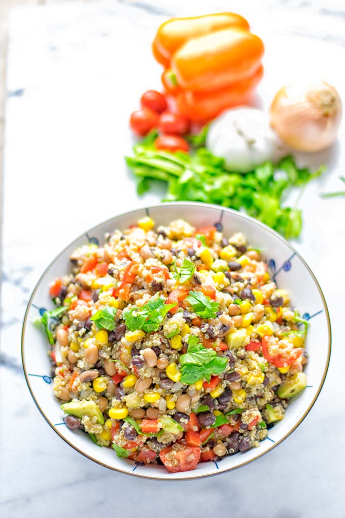 This Cowboy Caviar Quinoa Salad is naturally vegan, gluten free, and so satisfying. It has all the flavors you'll love and is super easy to make for dinner, lunch, meal prep and so much more. Enjoy and try it now You'll know how easy it can be. #vegan #glutenfree #dairyfree #vegetarian #cowboycaviar #quinoasalad #dinner #lunch #mealprep #worklunchideas #contentednesscooking #healthymeals #newyearhealthyeating #potluckideas #partyfood