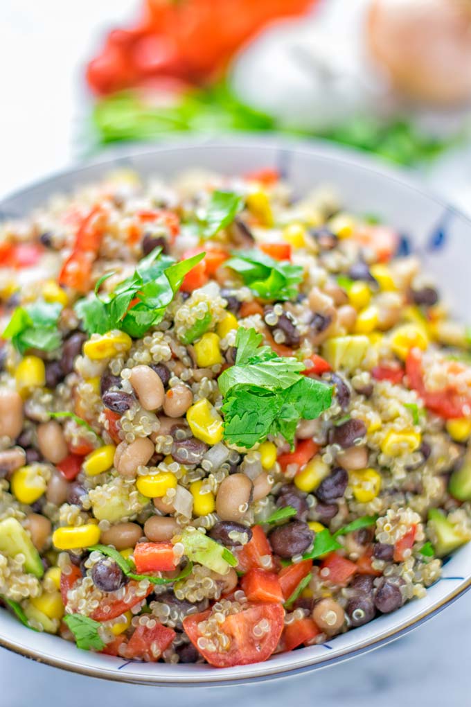 This Cowboy Caviar Quinoa Salad is naturally vegan, gluten free, and so satisfying. It has all the flavors you'll love and is super easy to make for dinner, lunch, meal prep and so much more. Enjoy and try it now You'll know how easy it can be. #vegan #glutenfree #dairyfree #vegetarian #cowboycaviar #quinoasalad #dinner #lunch #mealprep #worklunchideas #contentednesscooking #healthymeals #newyearhealthyeating #potluckideas #partyfood