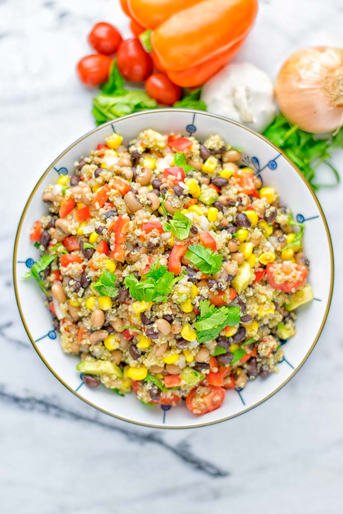 This Cowboy Caviar Quinoa Salad is naturally vegan, gluten free, and so satisfying. It has all the flavors you'll love and is super easy to make for dinner, lunch, meal prep and so much more. Enjoy and try it now You'll know how easy it can be. #vegan #glutenfree #dairyfree #vegetarian #cowboycaviar #quinoasalad #dinner #lunch #mealprep #worklunchideas #contentednesscooking #healthymeals #newyearhealthyeating #potluckideas #partyfood