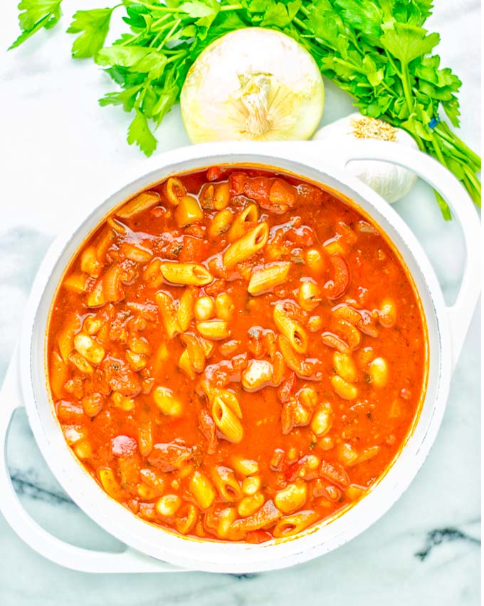 This Pasta Fagioli Soup is super easy to make in one pot and entirely vegan, gluten free. It's packed with so many delicious flavors and perfect for dinner, lunch, meal prep, work lunch and so much more. Try it and learn how easy it can be to make food for the whole family. #vegan #glutenfree #dairyfree #onepotmeals #vegetarian #contentednesscooking #mealprep #worklunchideas #dinner #lunch #pastafagiolisoup #20minutemeals