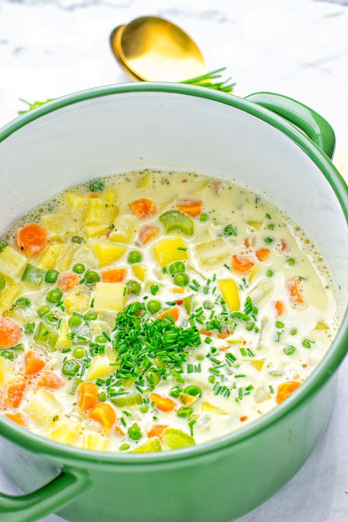 You won't believe this Vegan Pot Pie Soup is ready in 15 minutes. No one would guess it's vegan, gluten free, and dairy free. It's a satisfying meal made in one pot for lunch, dinner, meal prep even work lunches that you and your family will love. A time saving meal that is also a keeper for the holidays and Christmas. #vegan #glutenfree #dairyfree #vegetarian #onepotmeals #christmasfood #contentednesscooking #mealprep #dinner #lunch #worklunchideas #15minutemeals #holidaychristmas