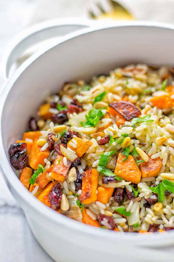 This Wild Rice Pilaf is a super easy and tasty one pot meal. Naturally vegan, gluten free it has all the flavors you love and want for Christmas and the whole year. Try it now for dinner, lunch, meal prep, wow your guests and family. #vegan #glutenfree #dairyfree #vegetarian #christmasfood #dinner #lunch #onepotmeals #holidayfood #wildricepilaf #ricepilafeasy #worklunchideas #contentednesscooking #mealprep