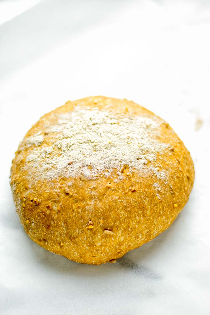 This Artisan Bread is naturally vegan, gluten free and made in the Dutch oven. It's easy to prepare in one bowl and the result will be impressive. Trust me there is nothing better than fresh homemade bread from the oven. This is perfect for breakfast, lunch and even dinner. Try this for your family and everyone will love it. #vegan #dairyfree #glutenfree #contentednesscooking #breakfast #dinner #lunch #artisanbread #nokneadbread #dutchovenbread #homemadebread #kidfriendlymeals #budgetmeals