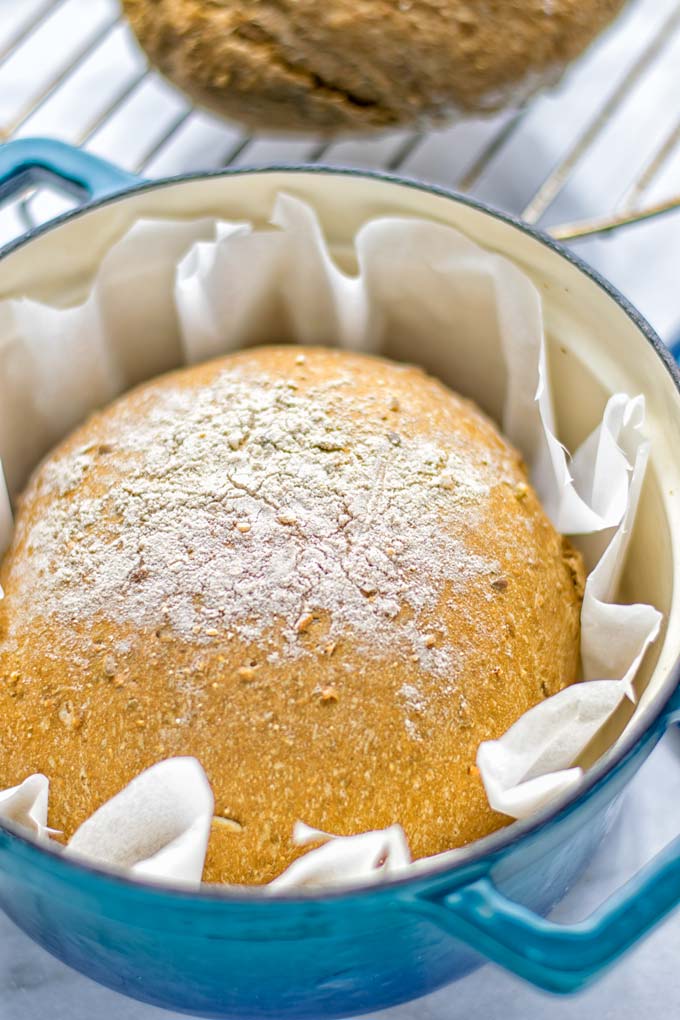 This Artisan Bread is naturally vegan, gluten free and made in the Dutch oven. It's easy to prepare in one bowl and the result will be impressive. Trust me there is nothing better than fresh homemade bread from the oven. This is perfect for breakfast, lunch and even dinner. Try this for your family and everyone will love it. #vegan #dairyfree #glutenfree #contentednesscooking #breakfast #dinner #lunch #artisanbread #nokneadbread #dutchovenbread #homemadebread #kidfriendlymeals #budgetmeals