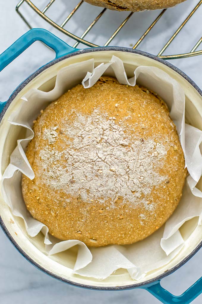 This Artisan Bread is naturally vegan, gluten free and made in the Dutch oven. It's easy to prepare in one bowl and the result will be impressive. Trust me there is nothing better than fresh homemade bread from the oven. This is perfect for breakfast, lunch and even dinner. Try this for your family and everyone will love it. #vegan #dairyfree #glutenfree #contentednesscooking #breakfast #dinner #lunch #artisanbread #nokneadbread #dutchovenbread #homemadebread #kidfriendlymeals #budgetmeals