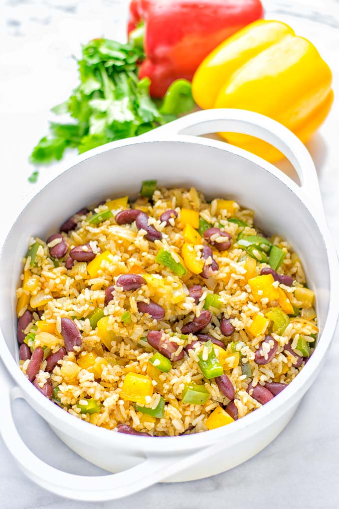 This Cajun Red Beans and Rice is an amazing one pot meal which is naturally vegan, gluten free. It's packed with bold and fantastic flavors the whole family will love for dinner, lunch, meal prep and work lunch and so much more. Once you've tried this you can't stop eating it so easy to make! #vegan #dairyfree #glutenfree #vegetarian #onepotmeals #dinner #lunch #worklunchideas #budgetmeals #contentednesscooking #cajunbeansandrice #mealprep