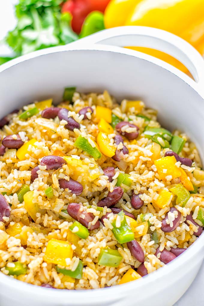 This Cajun Red Beans and Rice is an amazing one pot meal which is naturally vegan, gluten free. It's packed with bold and fantastic flavors the whole family will love for dinner, lunch, meal prep and work lunch and so much more. Once you've tried this you can't stop eating it so easy to make! #vegan #dairyfree #glutenfree #vegetarian #onepotmeals #dinner #lunch #worklunchideas #budgetmeals #contentednesscooking #cajunbeansandrice #mealprep