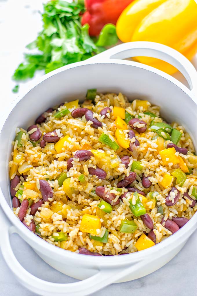 This Cajun Red Beans and Rice is an amazing one pot meal which is naturally vegan, gluten free. It's packed with bold and fantastic flavors the whole family will love for dinner, lunch, meal prep and work lunch and so much more. Once you've tried this you can't stop eating it so easy to make! #vegan #dairyfree #glutenfree #vegetarian #onepotmeals #dinner #lunch #worklunchideas #budgetmeals #contentednesscooking #cajunbeansandrice #mealprep
