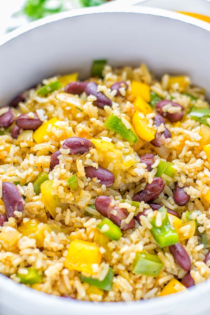 This Cajun Red Beans and Rice is an amazing one pot meal which is naturally vegan, gluten free. It's packed with bold and fantastic flavors the whole family will love for dinner, lunch, meal prep and work lunch and so much more. Once you've tried this you can't stop eating it so easy to make! #vegan #dairyfree #glutenfree #vegetarian #onepotmeals #dinner #lunch #worklunchideas #budgetmeals #contentednesscooking #cajunbeansandrice #mealprep