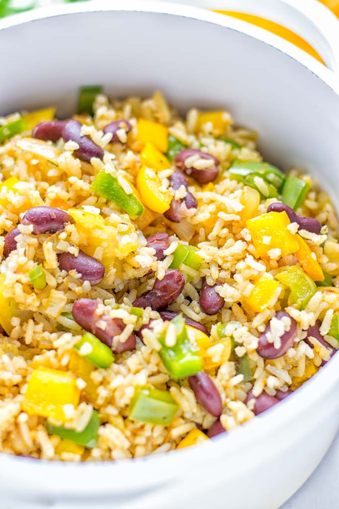 This Cajun Red Beans and Rice is an amazing one pot meal which is naturally vegan, gluten free. It's packed with bold and fantastic flavors the whole family will love for dinner, lunch, meal prep and work lunch and so much more. Once you've tried this you can't stop eating it so easy to make! #vegan #dairyfree #glutenfree #vegetarian #onepotmeals #dinner #lunch #worklunchideas #budgetmeals #contentednesscooking #cajunbeansandrice #mealprep