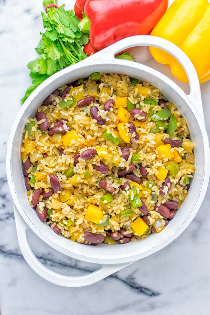 This Cajun Red Beans and Rice is an amazing one pot meal which is naturally vegan, gluten free. It's packed with bold and fantastic flavors the whole family will love for dinner, lunch, meal prep and work lunch and so much more. Once you've tried this you can't stop eating it so easy to make! #vegan #dairyfree #glutenfree #vegetarian #onepotmeals #dinner #lunch #worklunchideas #budgetmeals #contentednesscooking #cajunbeansandrice #mealprep