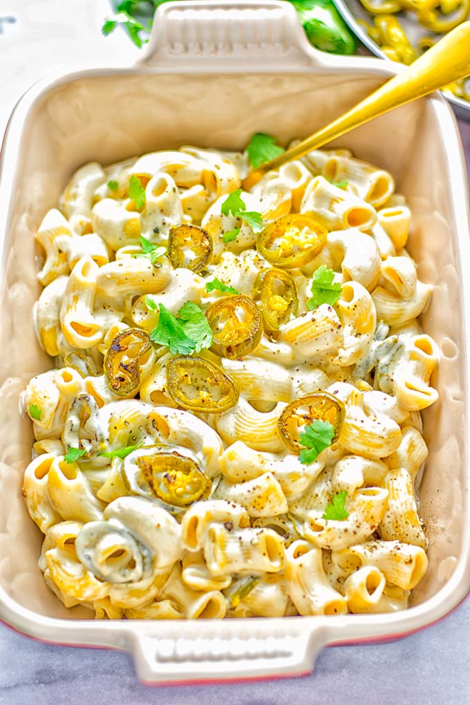 This Jalapeno Mac and Cheese is super easy to make and in 15 minutes on the table! It's creamy and perfectly spicy and entirely vegan, gluten free. An amazing option for dinner, lunch, meal prep, work lunch and so much more that the whole family will love. Try it for yourself and know this will be a staple in any house. #vegan #dairyfree #glutenfree #contentednesscooking #macandcheese #jalapeno #dinner #lunch #mealprep #worklunchideas #15minutemeals #familyfood #comfortfood