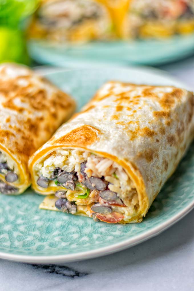 This Rice and Beans Quesarito is entirelly vegan, gluten free and so easy to make. It's cheesy, incredibly satisfying and so delicious for dinner, lunch, meal prep (reheat beautifully) and amazing for work lunches. An amazing dairy free alternative for everyone that the whole family will love. #vegan #glutenfree #dairyfree #vegetarian #contentednesscooking #quesarito #riceandbeans #dinner #lunch #worklunchideas #mealprep #quesadila #burrito