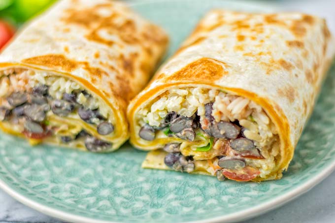 This Rice and Beans Quesarito is entirelly vegan, gluten free and so easy to make. It's cheesy, incredibly satisfying and so delicious for dinner, lunch, meal prep (reheat beautifully) and amazing for work lunches. An amazing dairy free alternative for everyone that the whole family will love. #vegan #glutenfree #dairyfree #vegetarian #contentednesscooking #quesarito #riceandbeans #dinner #lunch #worklunchideas #mealprep #quesadila #burrito