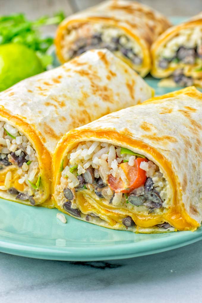 This Rice and Beans Quesarito is entirelly vegan, gluten free and so easy to make. It's cheesy, incredibly satisfying and so delicious for dinner, lunch, meal prep (reheat beautifully) and amazing for work lunches. An amazing dairy free alternative for everyone that the whole family will love. #vegan #glutenfree #dairyfree #vegetarian #contentednesscooking #quesarito #riceandbeans #dinner #lunch #worklunchideas #mealprep #quesadila #burrito