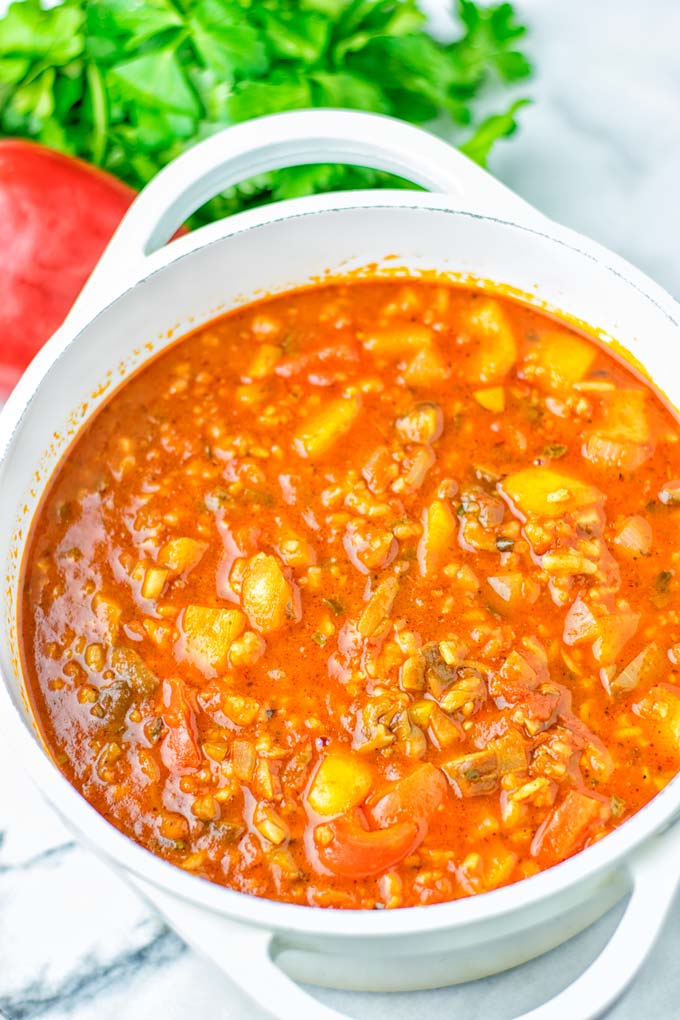 This Stuffed Pepper Soup is full of flavor with little preparation. In only 15 minutes, you have an easy and satisfying one pot meal which is naturally vegan, gluten free. Packed with mesmerizing flavors that the whole family will love for dinner, lunch, meal prep and so much more. Try it now and you will want this every day. #vegan #glutenfree #dairyfree #onepotmeals #vegetarian #mealprep #worklunchideas #stuffedpeppersoup #contentednesscooking #dinner #lunch