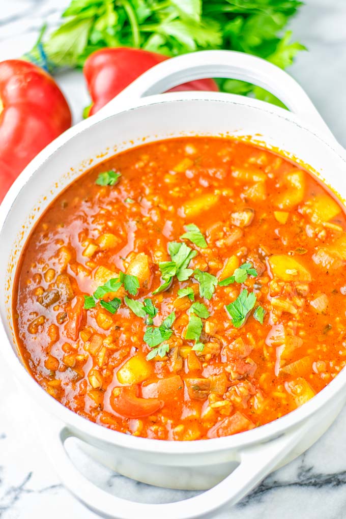 This Stuffed Pepper Soup is full of flavor with little preparation. In only 15 minutes, you have an easy and satisfying one pot meal which is naturally vegan, gluten free. Packed with mesmerizing flavors that the whole family will love for dinner, lunch, meal prep and so much more. Try it now and you will want this every day. #vegan #glutenfree #dairyfree #onepotmeals #vegetarian #mealprep #worklunchideas #stuffedpeppersoup #contentednesscooking #dinner #lunch